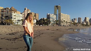 Risky masturbation on a public beach in Benidorm. Fetish Wet Sneakers. The girl pees beautifully in jeans. Fingering. Russian pornstar Sasha Bikeyeva